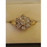 9ct yellow gold 7 diamond cluster ring in claw setting.