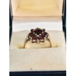 9ct gold 9 stone ruby dress ring.