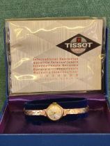 Ladies 9ct gold Tissot watch in working condition with original box and paperwork. 11.2g gold