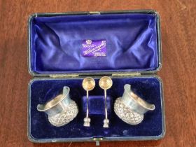 A cased pair of Thistle shaped salts with matching silver gilt spoons by John Millward Banks,