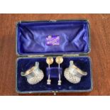 A cased pair of Thistle shaped salts with matching silver gilt spoons by John Millward Banks,