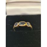 9ct yellow gold 3 stone sapphire ring in rubover setting.