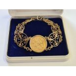 1908 gold full sovereign mounted in 9ct gold bracelet of 6 interlinked roundels. Total weight 25.