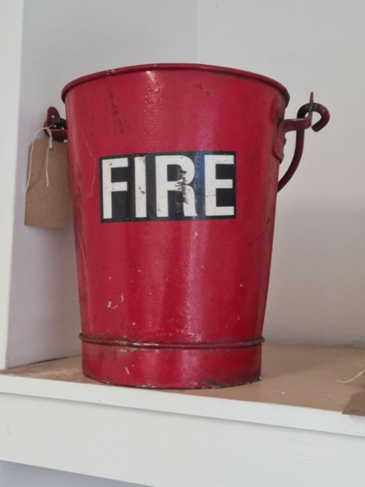 Vintage red fire bucket.