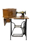 Oak cased Singer sewing table with sewing machine