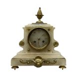 A 19th century French mantle clock in an alabaster case with cast brass mounts and pineapple finial