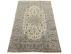 Persian ivory ground Kashan rug