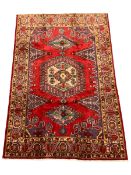 Persian red ground rug