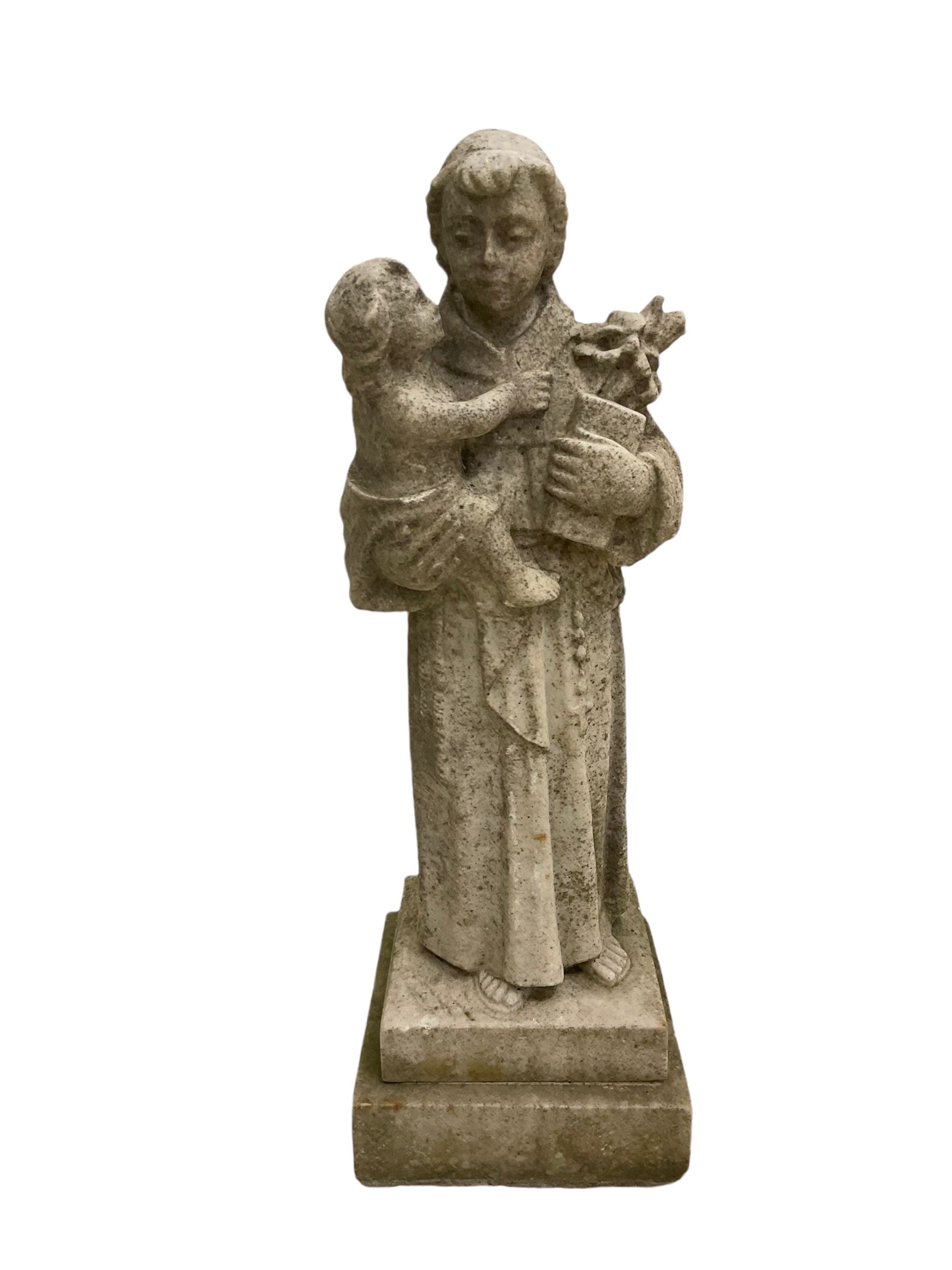 Marble statue of St Dominic holding Christ child