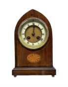 An Edwardian mahogany veneered Lancet cased mantle clock with oval inlay and stringing