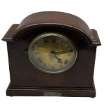An American early 20thth century eight-day mantle clock in a mahogany case striking the hours and ha