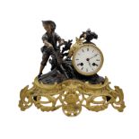 A French 19th century mantle clock depicting a farm boy with a plough at work beside a drum cased cl