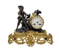 A French 19th century mantle clock depicting a farm boy with a plough at work beside a drum cased cl