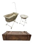 late 19th century case containing brass and cream painted iron crib and bassinet by The Universal Fo
