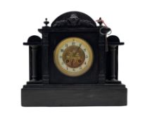 A late 19th century French mantle clock in a Belgium slate case with an arched top and stepped plin