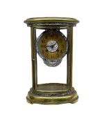 An early 20th century French oval four glass clock with cloisonne decoration