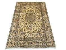 Persian Kashan golden ivory ground rug