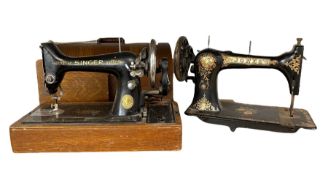 Jones' C.S. Medium cast iron sewing machine and a Singer sewing machine in oak case (2)