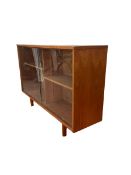Teak bookcase with two sliding glass doors enclosing shelves