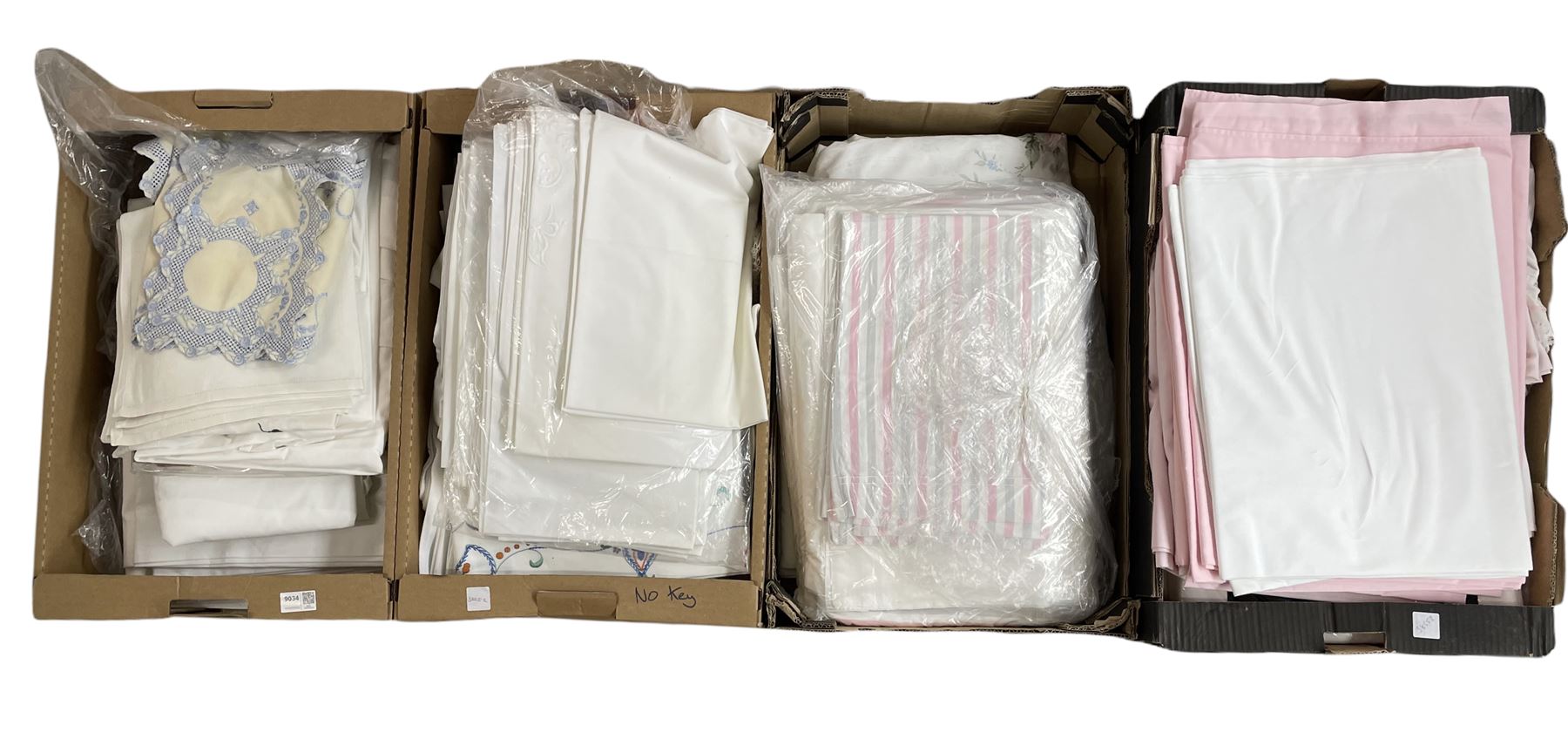 Four boxes of bed and table linen