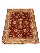 Red and ivory ground rug