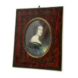 Miniature oval half length portrait of a lady in Boulle type frame