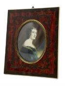 Miniature oval half length portrait of a lady in Boulle type frame