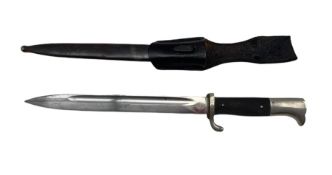 German Carl Eickhorn Solingen bayonet with two piece chequered grip and scabbard