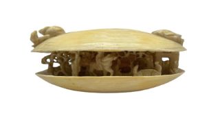 19th/ early 20th century carved ivory Okimono 'The Clams Dream' the shell half open to reveal a figu