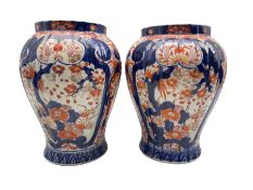 Pair of Japanese Meiji period Imari pattern vases of fluted inverted baluster form