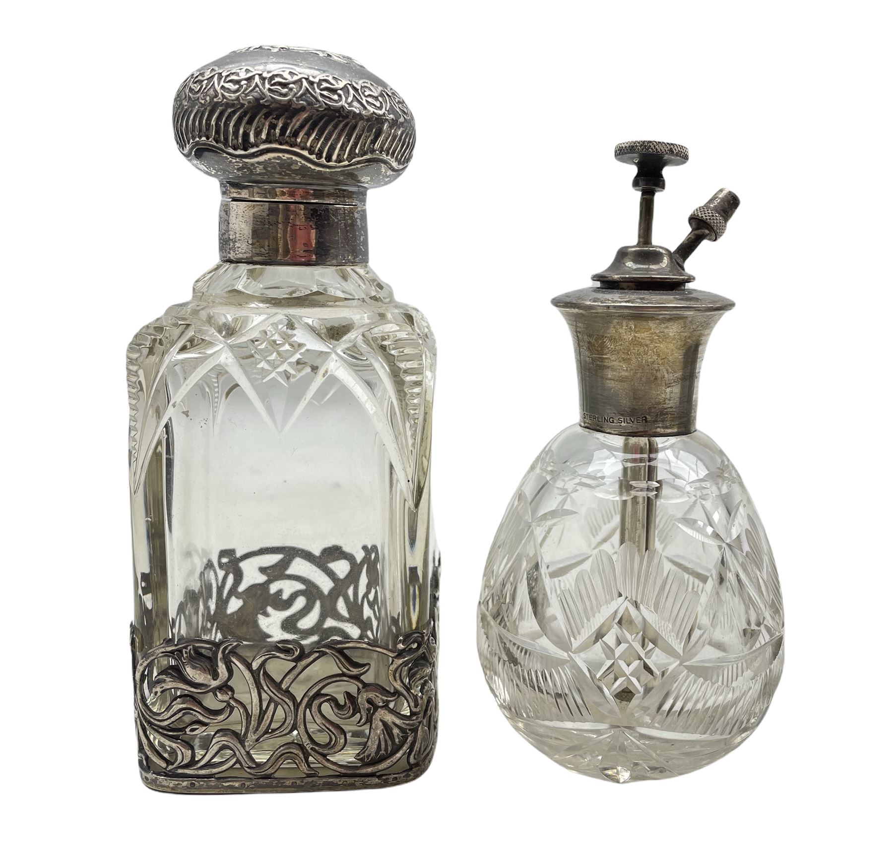 Edwardian silver and cut glass scent bottle with embossed cover and Art Nouveau style pierced silver