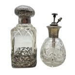 Edwardian silver and cut glass scent bottle with embossed cover and Art Nouveau style pierced silver