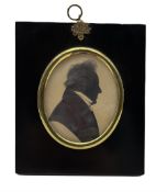 19th century oval silhouette portrait of a gentleman with highlights 9cm x 8cm in ebonised frame