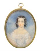 Unsigned 19th century oval half length miniature portrait on ivory of a young lady with ringlets in