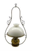 Victorian brass hanging oil lamp having a brass oil reservoir