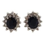 Pair of 9ct gold sapphire and diamond chip cluster stud earrings