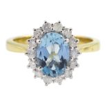 18ct gold oval aquamarine and round brilliant cut diamond cluster ring