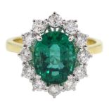 18ct gold oval emerald and round brilliant cut diamond cluster ring