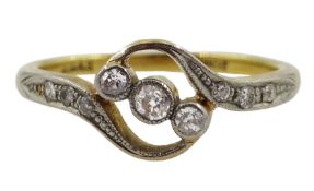 Early 20th century three stone diamond crossover ring