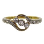 Early 20th century three stone diamond crossover ring