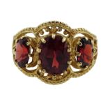 9ct gold three stone oval garnet ring