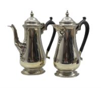 Silver coffee pot and matching hot water jug of baluster design with domed covers and ebonised handl
