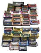 A large collection of diecast coaches