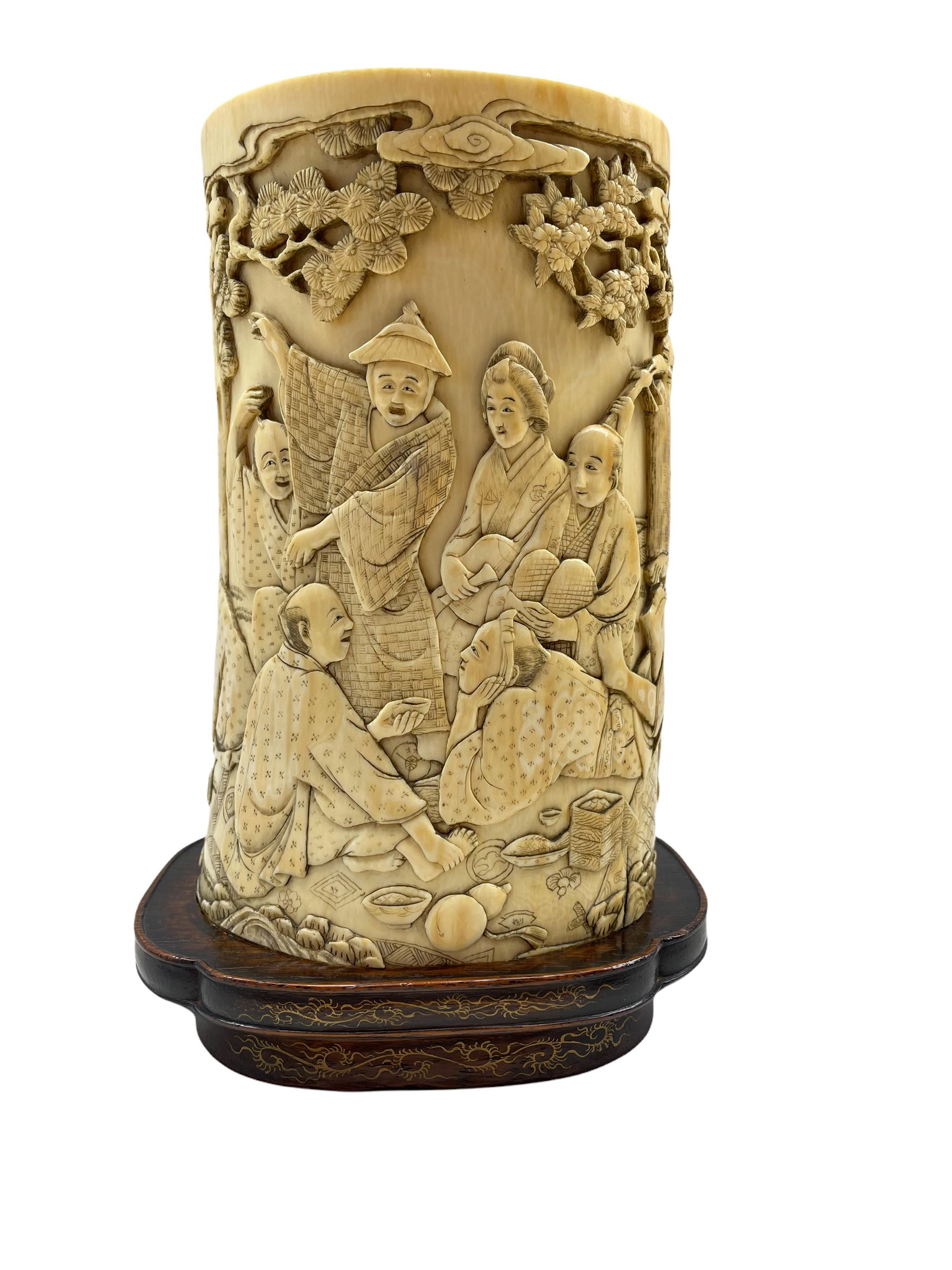 19th century Japanese ivory tusk vase finely carved with a continuous scene of figures gathered outs - Image 3 of 7