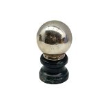 Witches type desk ball mounted on greenstone plinth