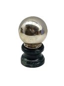 Witches type desk ball mounted on greenstone plinth