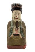 Chinese carved wood and painted archaic style figure decorated in red