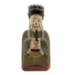 Chinese carved wood and painted archaic style figure decorated in red