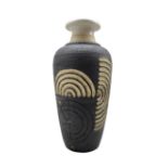 Patrick Oates (Irish 1948-): carved and incised stoneware vase with slightly flared rim