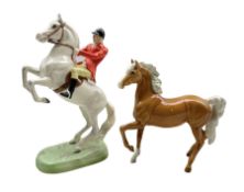 Beswick Huntsman on white painted rearing horse no.868 H25cm (a/f) together with a Beswick Palomino